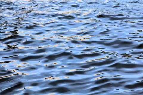 Gold colored waves Stock Photos