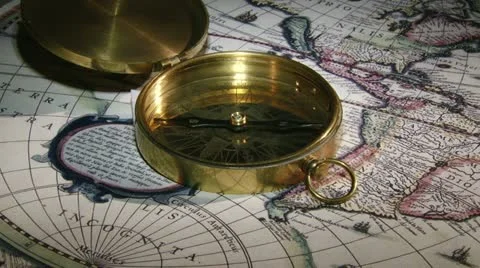 Gold compass, candle, old map Stock Footage 12369737