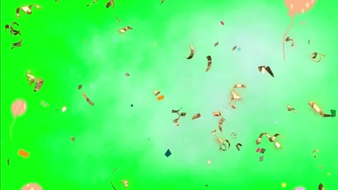 Gold confetti and balloons falling on green background Video stock 338222212