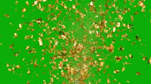 Gold confetti explodes upwards on a green screen background Stockbeeldmateriaal 331766624