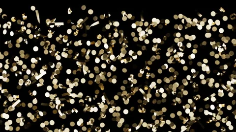 Gold confetti pieces falling downward, metallic paper scraps drift and rota.. Видео 342137916