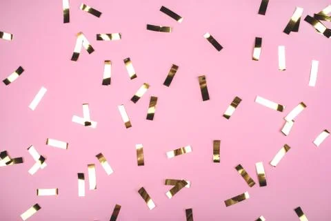 Gold confetti on pink background. Stock Illustration