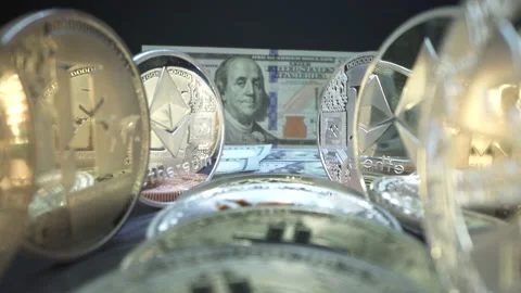 Gold crypto coins Bitcoin, Etherium, Zcash on the table in line with reflection Stock Footage 141716809