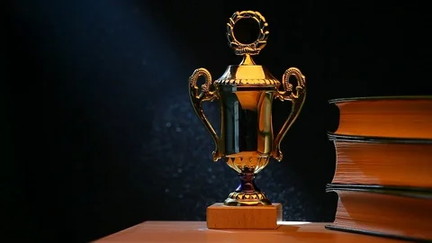 Gold cup table books Stock Footage 93100887