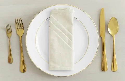 Gold cutlery table setting flatlay Stock Photos