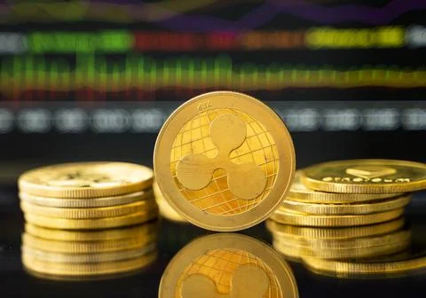 Gold Dash coin with a graph chart. Trading on the cryptocurrency exchange Stock Photos