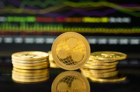 Gold Dash coin with a graph chart. Trading on the cryptocurrency exchange Stock Photos