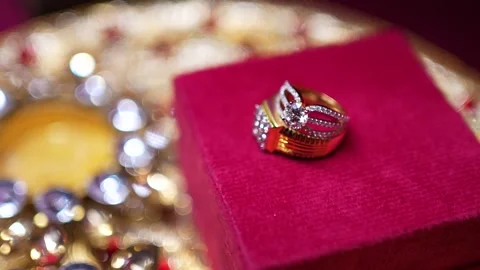 Gold Diamond Engagement Ring on Red Velvet Box at Indian Wedding Stock Footage 345708104