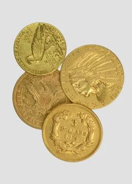 Gold dollars on a gray background Stock Photos