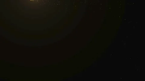 Gold dust particles fly in slow motion in the air lingering slowly.  Stock Footage 224436430