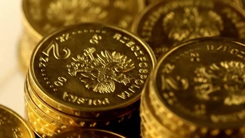 Gold Eagle one ounce coins being poured down onto a pile of other golden mone Video stock 272770155