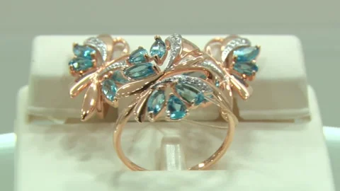 Gold earrings and ring Stock Footage 256073250