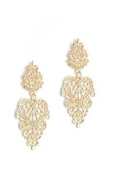 Gold earrings with a pattern isolated on white Stock Photos