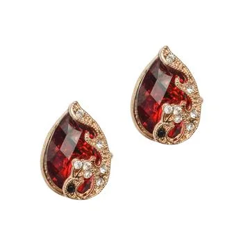 Gold earrings with ruby isolated on white Stock Photos