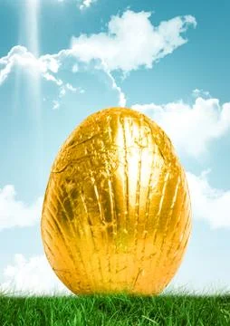 Gold Easter egg in front of blue sky Stock Illustration