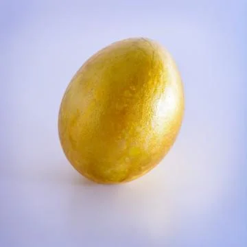 Gold easter-egg on white background Stock Photos