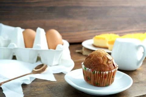 Gold egg yolk thread cakes, banana cake on the wooden table in cafe Stock Photos