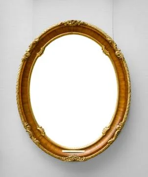 Gold empty frame on white wall Stock Photos