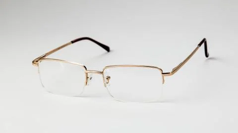 Gold eyeglasses on white background isolate Stock Photos