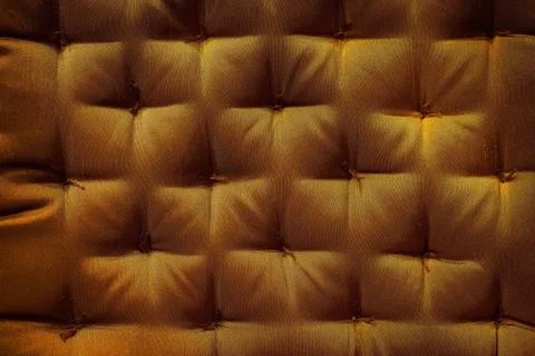 Gold fabric texture with button Stock Photos