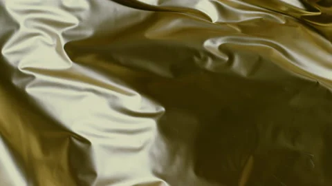 Gold fabric texture moving in super slow motion Stock Footage 235471576