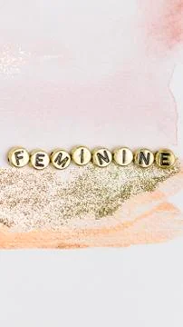 Gold feminine alphabet letter beads Stock Photos