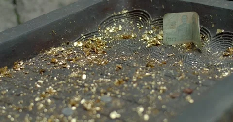 Gold flame.Gold leaf is part of the creation of sacred things in Thailand. Stock Footage 266441011