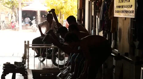 Gold flattering - beating process in Myanmar - workers silhouettes Stock Footage 61204641