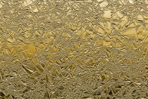 Gold foil texture abstract background. Use for text or design. Stock Photos