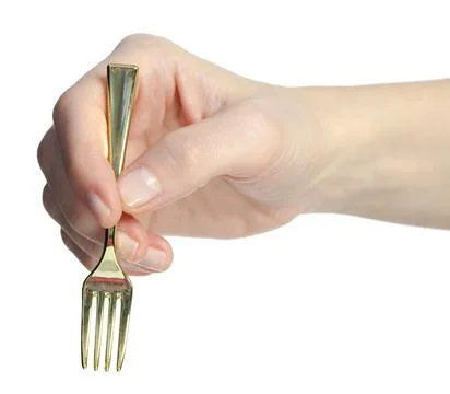 Gold fork in hand Stock Photos