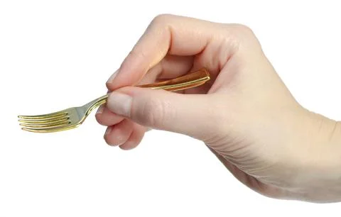 Gold fork in hand Stock Photos