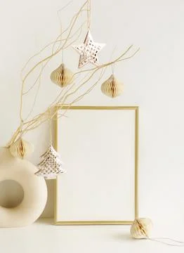 Gold frame blank mockup with copy space and Christmas decoration on white backgr Stock Photos