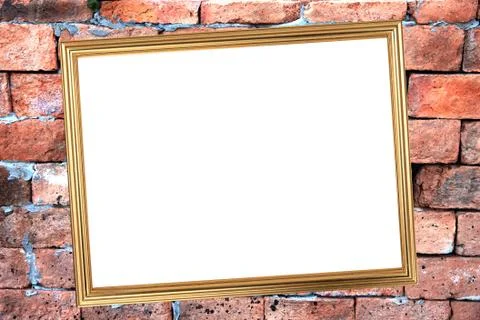 Gold frame on brick background of stone. Stock Photos