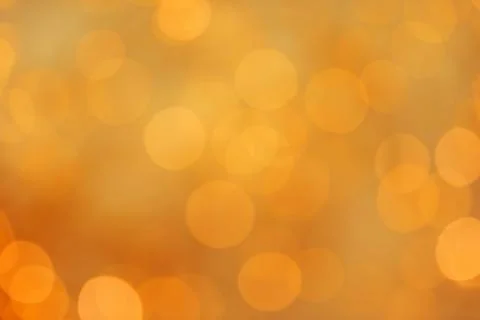 Gold glitter with bokeh effect on light background Stock Photos