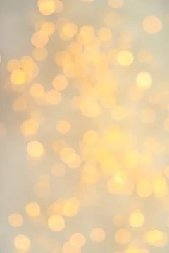 Gold glitter with bokeh effect on light background Stock Photos