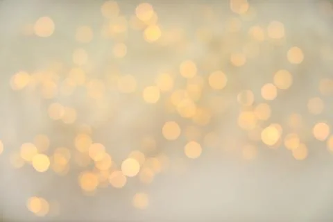 Gold glitter with bokeh effect on light background Stock Photos