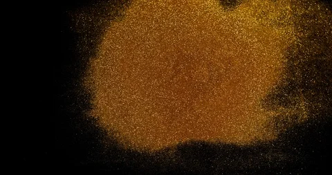 Gold Glitter exploding on Black Background, Slow Motion 4K Stock Footage 112359526
