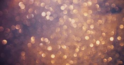 Gold glitter sparkling on a dark surface with gritty texture Stock Footage 55634086
