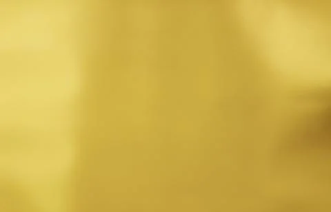 Gold gradient blurred background with soft glowing backdrop, background textu Stock Photos