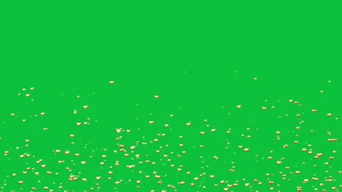 Gold hearts particles in seamless loop overlay on green screen chroma key 4k Stock Footage 296115348