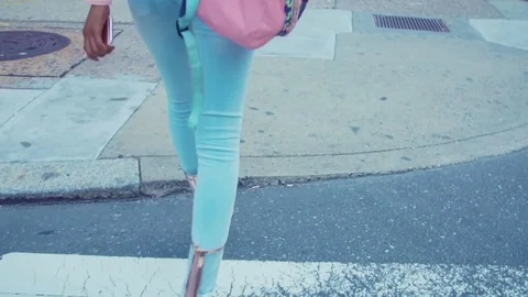 Gold high heels walking down sidewalk Stock Footage 74750587