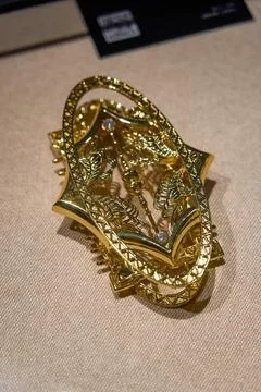 Gold Hollow Leaf Pattern Curved Metal Brooch Exhibit Stock Photos
