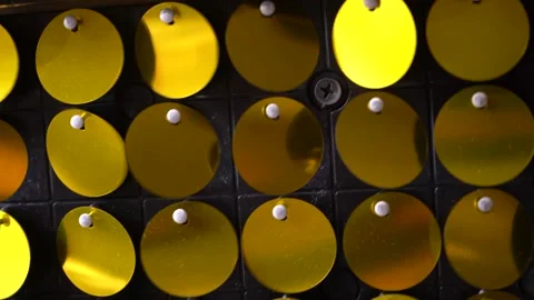 Gold iridescent sequins that reflect light.  Stock Footage 159227726