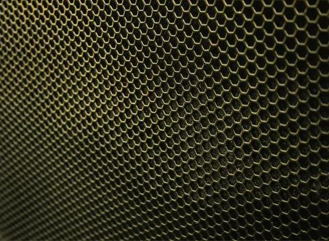 Gold iron hexagonal texture. Industrial background Stock Photos