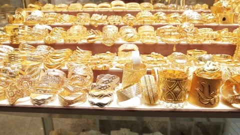 Dubai, UAE , 2022 - most expensive shop items - luxury golden dresses and  outfits for woman on shop display in gold souk in old Dubai 16191194 Stock  Video at Vecteezy