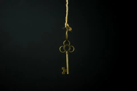 Gold key hanging Stock Photos