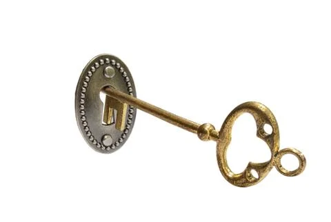 Gold key on white Stock Photos