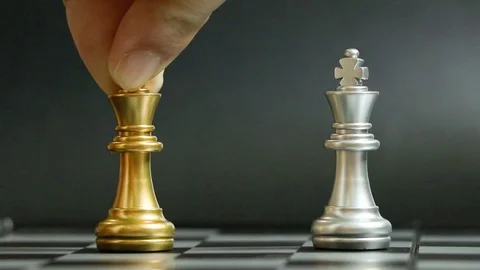 Gold king chess piece knock and win over silver team on black background (Con Stock Footage 127818609