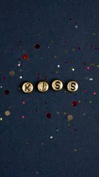 Gold kiss alphabet letter beads Stock Photos