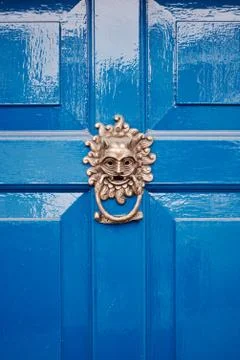 Gold knocker on door Stock Photos